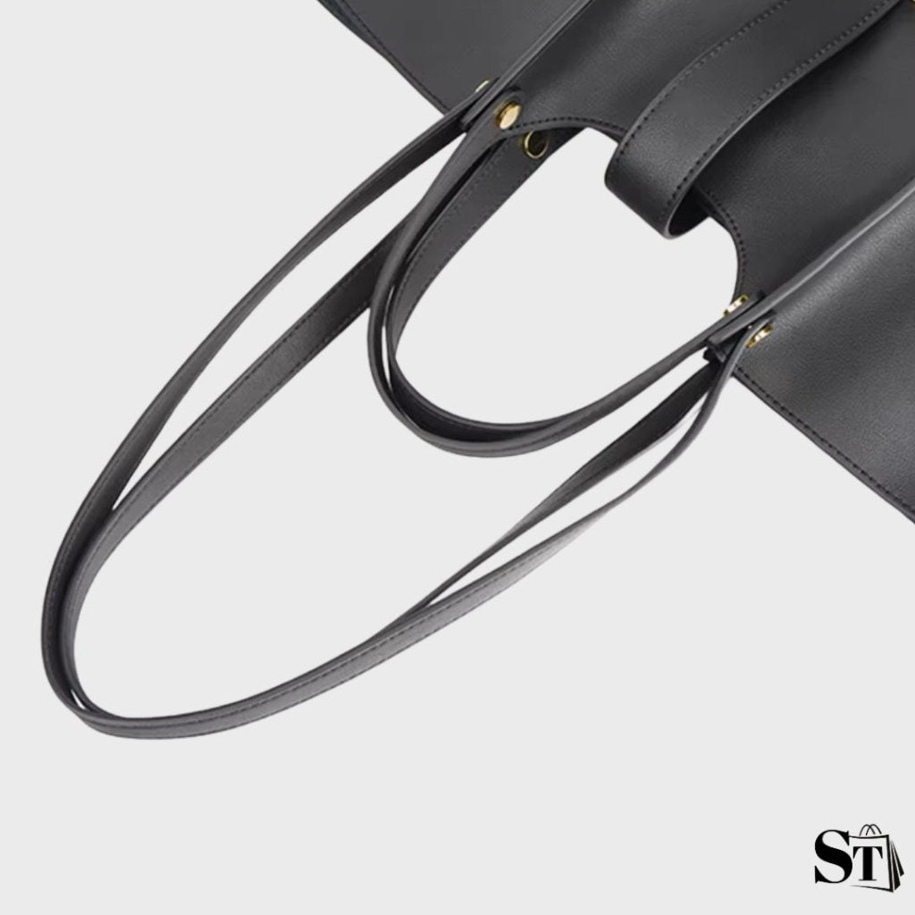 Zoom sur les poignées et bandoulières du sac cabas structuré Cézanne en noir sur fond blanc
