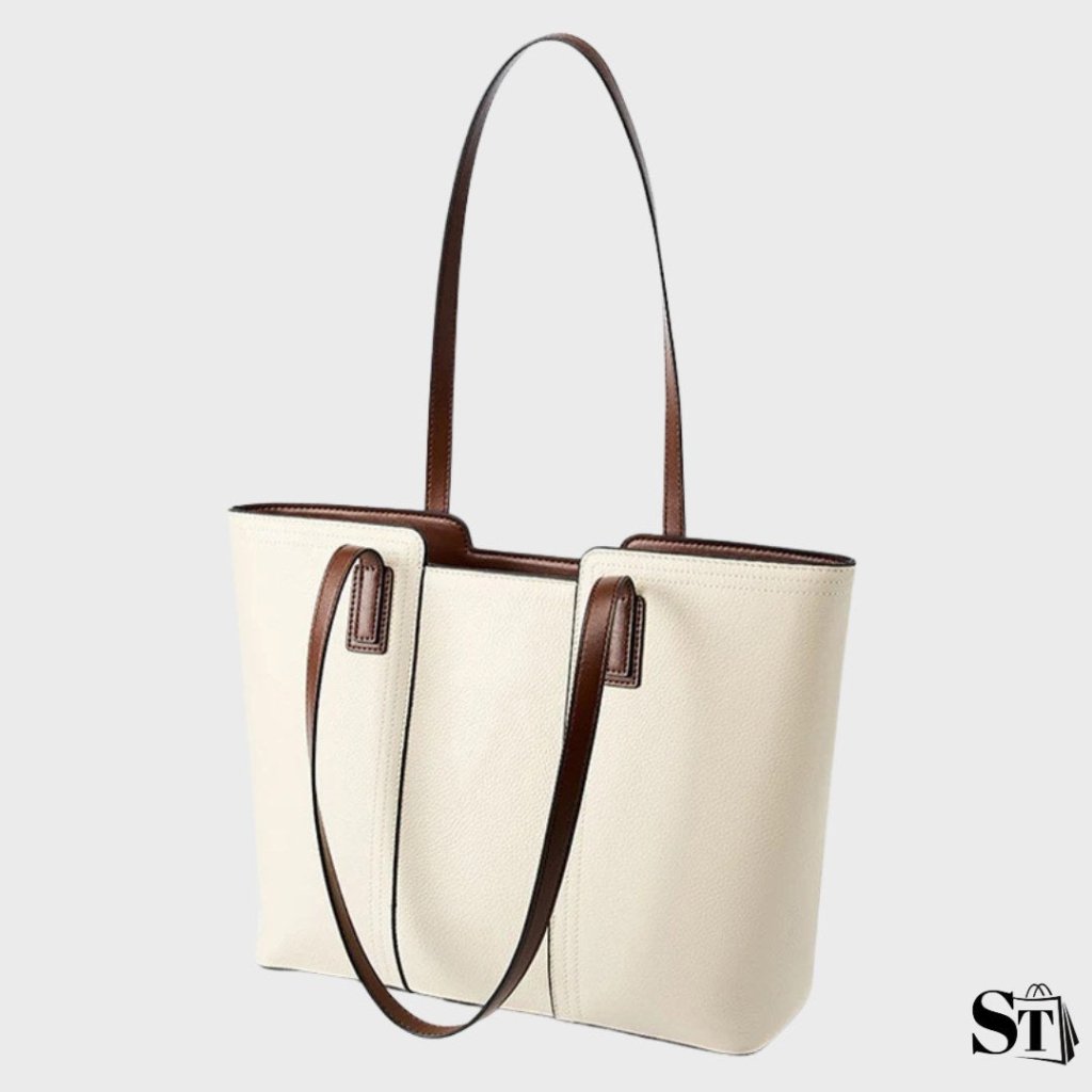 Sac cabas Le Solène en cuir véritable blanc cassé avec anses marron foncé, vu en perspective.