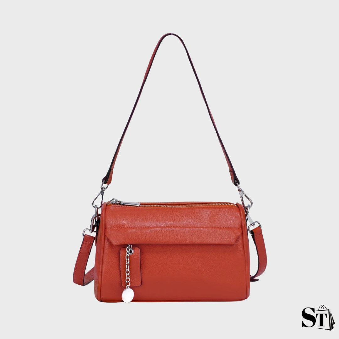 sac à bandoulière en cuir pour femme, forme pillow, fermeture zippée, détail chaîne, poche extérieure – modèle Le Closat