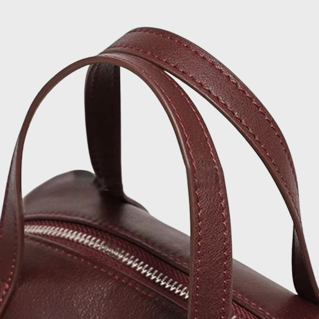 Vue de dessus du sac Boston montrant la fermeture éclair fluide et les anses robustes