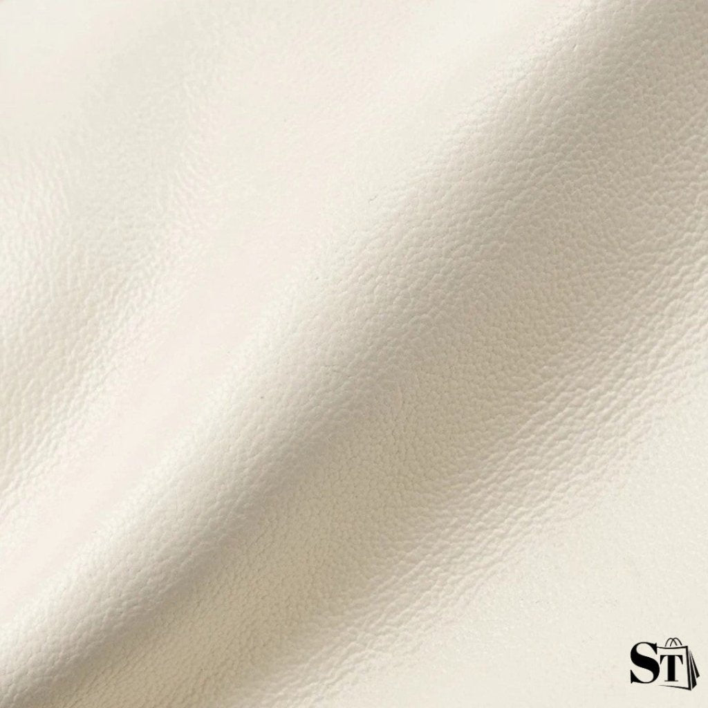 Zoom sur le cuir véritable blanc du sac Cocon – texture douce et souple en gros plan